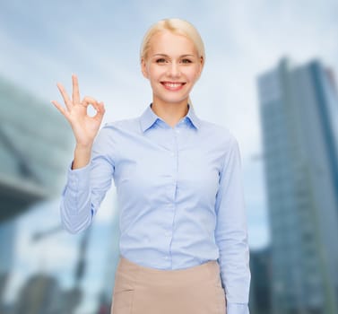 business and education concept - smiling businesswoman showing ok-sign with hand