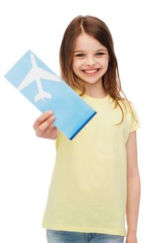 travel, holiday, vacation, childhood and transportation concept - smiling little girl with airplane ticket
