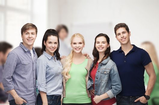 education and people concept - group of standing smiling students