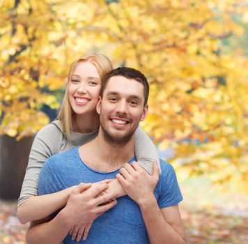 love and family concept - smiling couple hugging