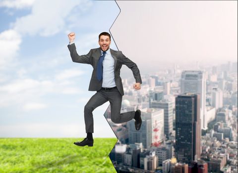 business, education and people concept - smiling happy businessman jumping