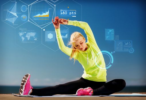 sport, training, technology and lifestyle concept - young woman exercising outdoors