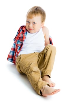Funny blue-eyed three-year boy on a white background. Studio photo