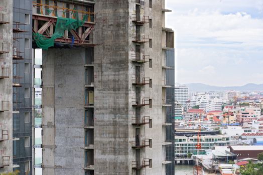 Abandoned high-rise condominium building at the seashore in Pattaya, Thailand. The project was stopped after the military government found that the developers didn’t have a permit to build.