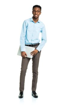Happy african american college student with laptop standing on white background