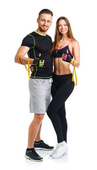 Athletic man and woman after fitness exercise with a thumb up on the white background
