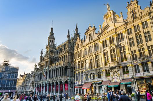 Brussels, Belgium - May 13, 2015: Many tourists visiting famous Grand Place (Grote Markt) the central square of Brussels. The square is the most important tourist destination and most memorable landmark in Brussels.