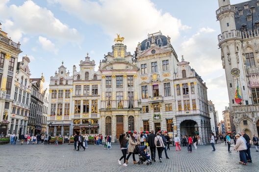 Brussels, Belgium - May 13, 2015: Many tourists visiting famous Grand Place (Grote Markt) the central square of Brussels. The square is the most important tourist destination and most memorable landmark in Brussels. 