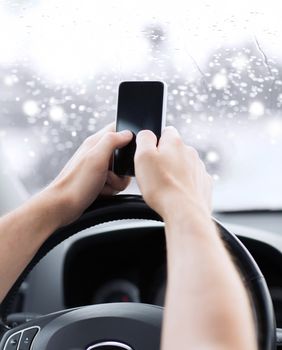 transportation, people, technology and vehicle concept - close up of man using smartphone while driving car