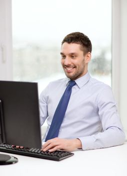 office, business, education, technology and internet concept - smiling businessman or student with computer