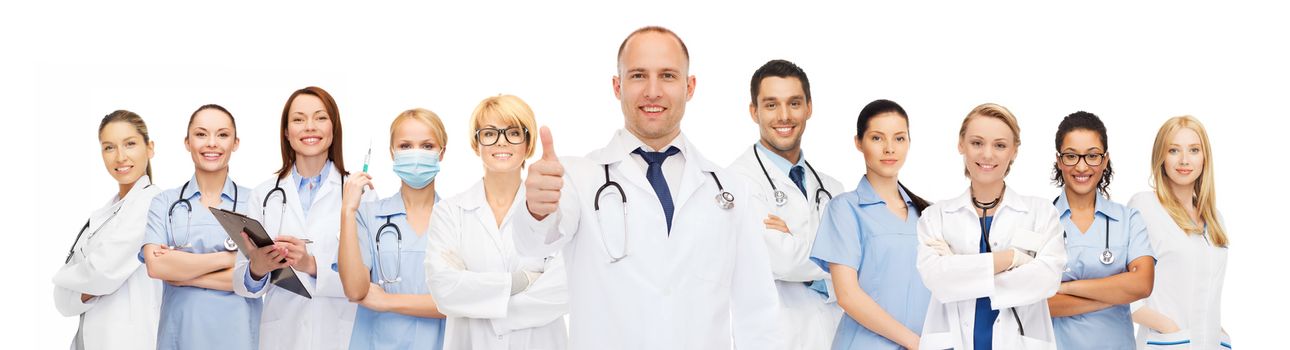 medicine, profession, teamwork and healthcare concept - international group of smiling medics or doctors with clipboard and stethoscopes with showing thumbs up over white background