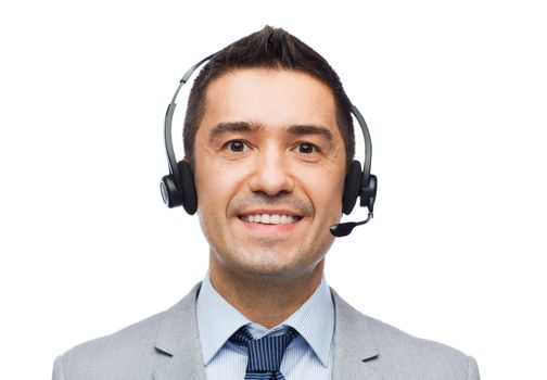 business, people, technology and service concept - smiling businessman in headset