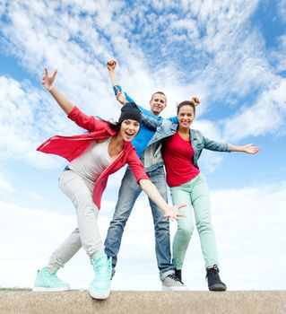 sport, dancing and urban culture concept - group of teenagers dancing