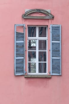 Old window with wooden shutters