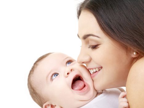family and happy people concept - mother kissing her baby