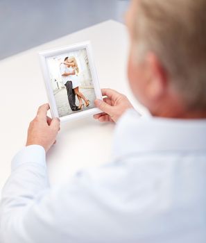 oldness, memories, nostalgia and people concept - close up of old man holding and looking at happy young couple photo