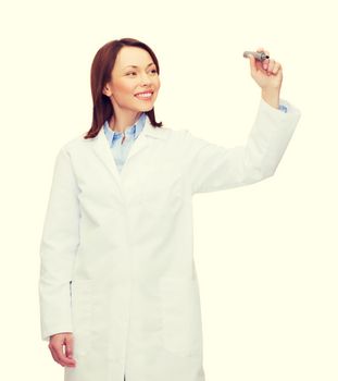 healthcare, medical and technology concept - young female doctor writing something in the air