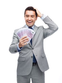 business, people and finances concept - happy laughing businessman with euro money