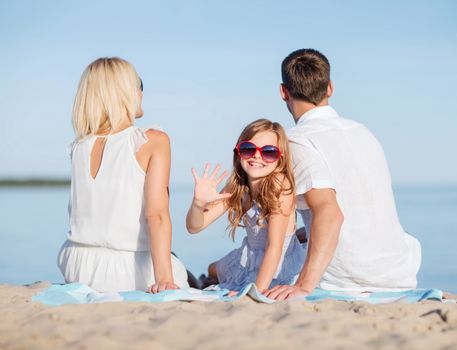 summer holidays, children and people concept - happy family on the beach