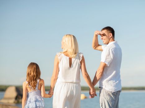 summer holidays, children and people concept - happy family at the seaside