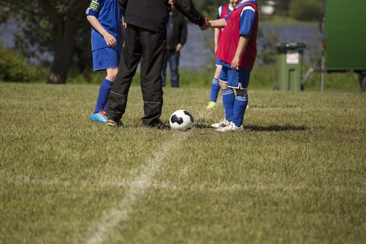 A hand shake before the game wishing the other team good luck.