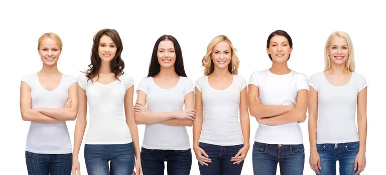 clothing design and people unity concept - group of happy smiling women in blank white t-shirts and jeans