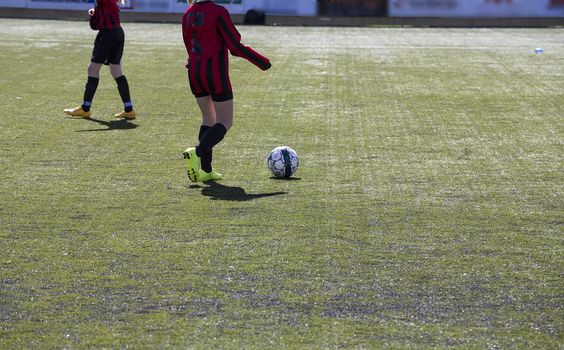 a ball and two players warming up before the game starts