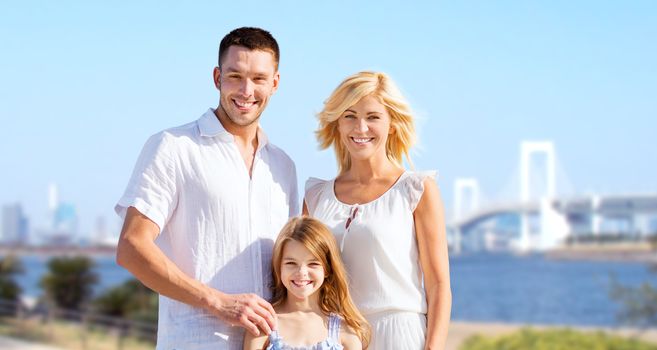 summer holidays, travel, tourism and people concept - happy family over rainbow bridge background