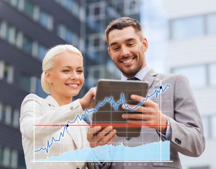 business, partnership, technology and people concept - smiling businessman and businesswoman with tablet pc computer over office building background