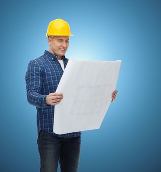 repair, construction, building, people and maintenance concept - smiling male builder or manual worker in helmet with blueprint over blue background