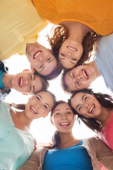 friendship, youth and people - group of smiling teenagers in circle