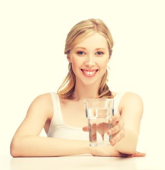 closeup of young smiling woman with glass of water