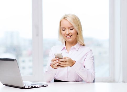 education, business, communication and technology concept - smiling businesswoman or student with smartphone texting message in office