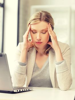 picture of tired woman with laptop computer