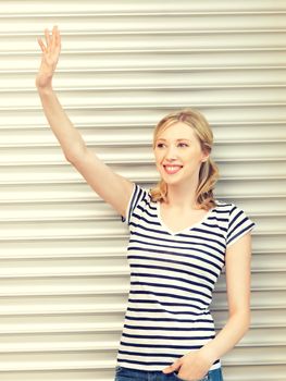 picture of happy teenage girl waving a greeting