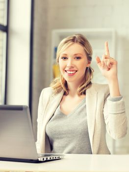 happy woman with laptop computer and finger up