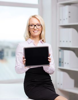 education, business and technology concept - smiling businesswoman or student showing tablet pc computer blank screen in office