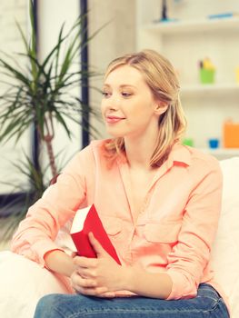 bright picture of happy and smiling woman with book..