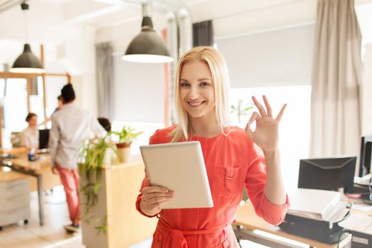 business, startup and people concept - happy businesswoman or creative female office worker with tablet pc computer showing ok hand sign