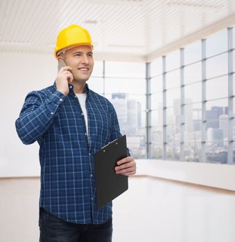 construction, building, people, technology and maintenance concept - smiling male builder or manual worker in helmet with clipboard calling on smartphone over empty flat background