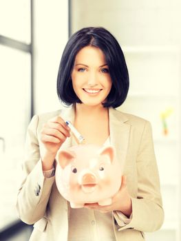 picture of lovely woman with piggy bank and money