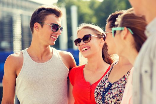 friendship, leisure, summer and people concept - group of smiling friends in city