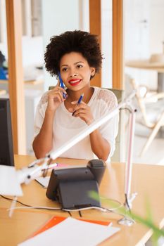 business, startup and people concept - happy african american businesswoman or creative worker calling on smartphone at office