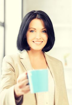 bright picture of lovely businesswoman with mug.