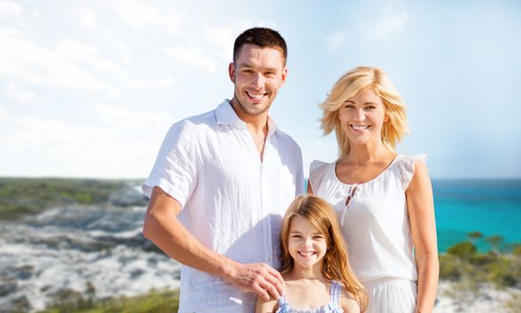 holidays, travel, tourism and people concept - happy family over summer beach background