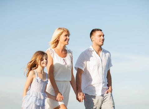 summer holidays, children and people concept - happy family at the seaside