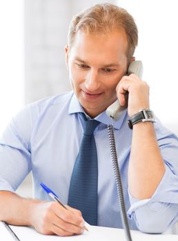 picture of handsome businessman talking on the phone