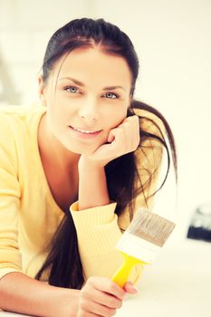 bright picture of lovely housewife painting at home