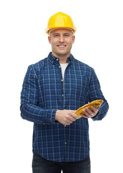 repair, building, construction and maintenance concept - smiling man in helmet with gloves