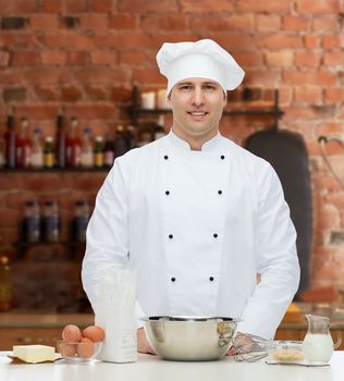 cooking, profession, haute cuisine, food and people concept - happy male chef cook baking over kitchen background